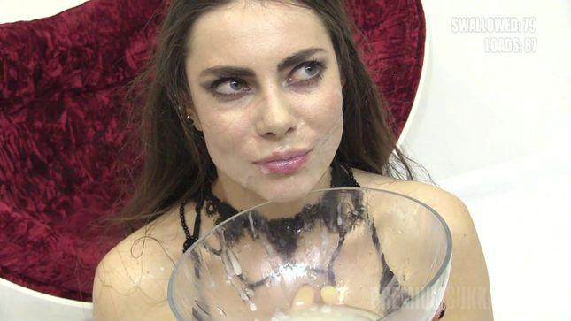 Black-haired slut gets a mouthful of cum
