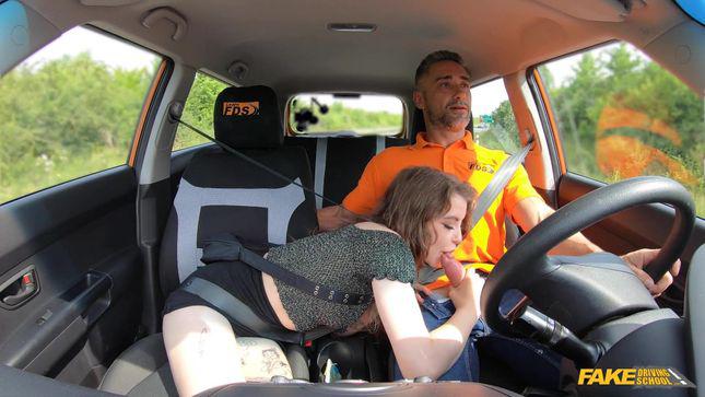 Tattooed babe learns to drive and fucks in a car